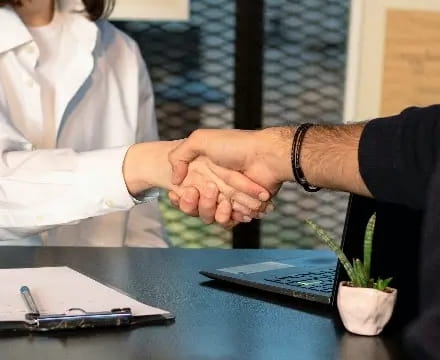 Two people shaking hands